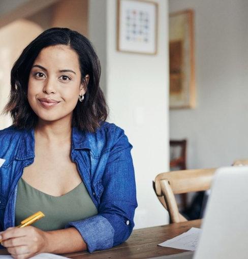 Woman at laptop smiling