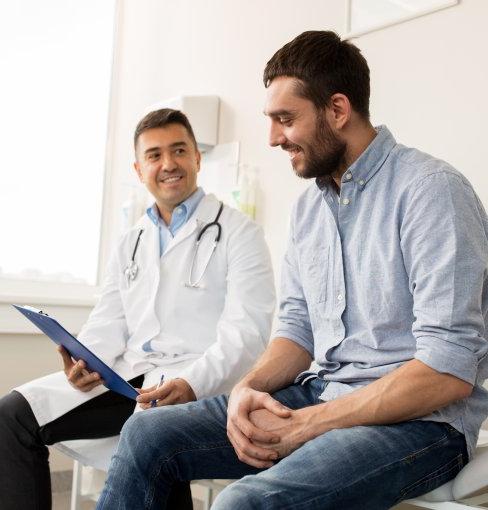 two men sitting in doctors 办公室